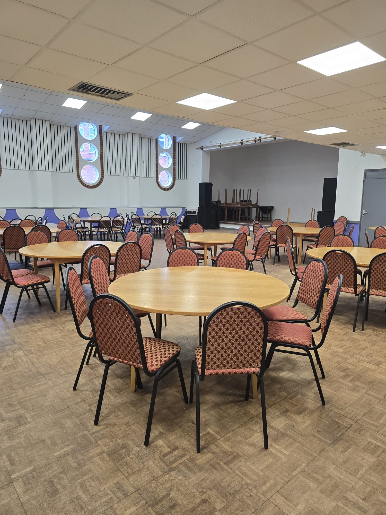 Another view of the function room with round tables and chairs laid out
